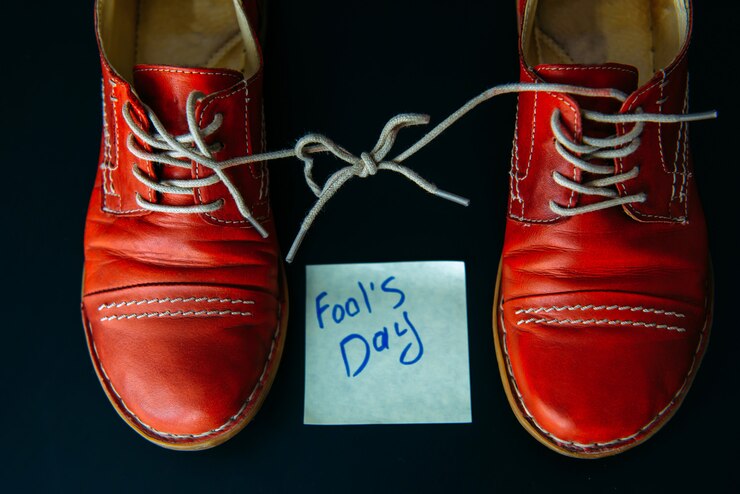shoes-with-laces-tied-together-black-background-shoes-covered-sticky-notes